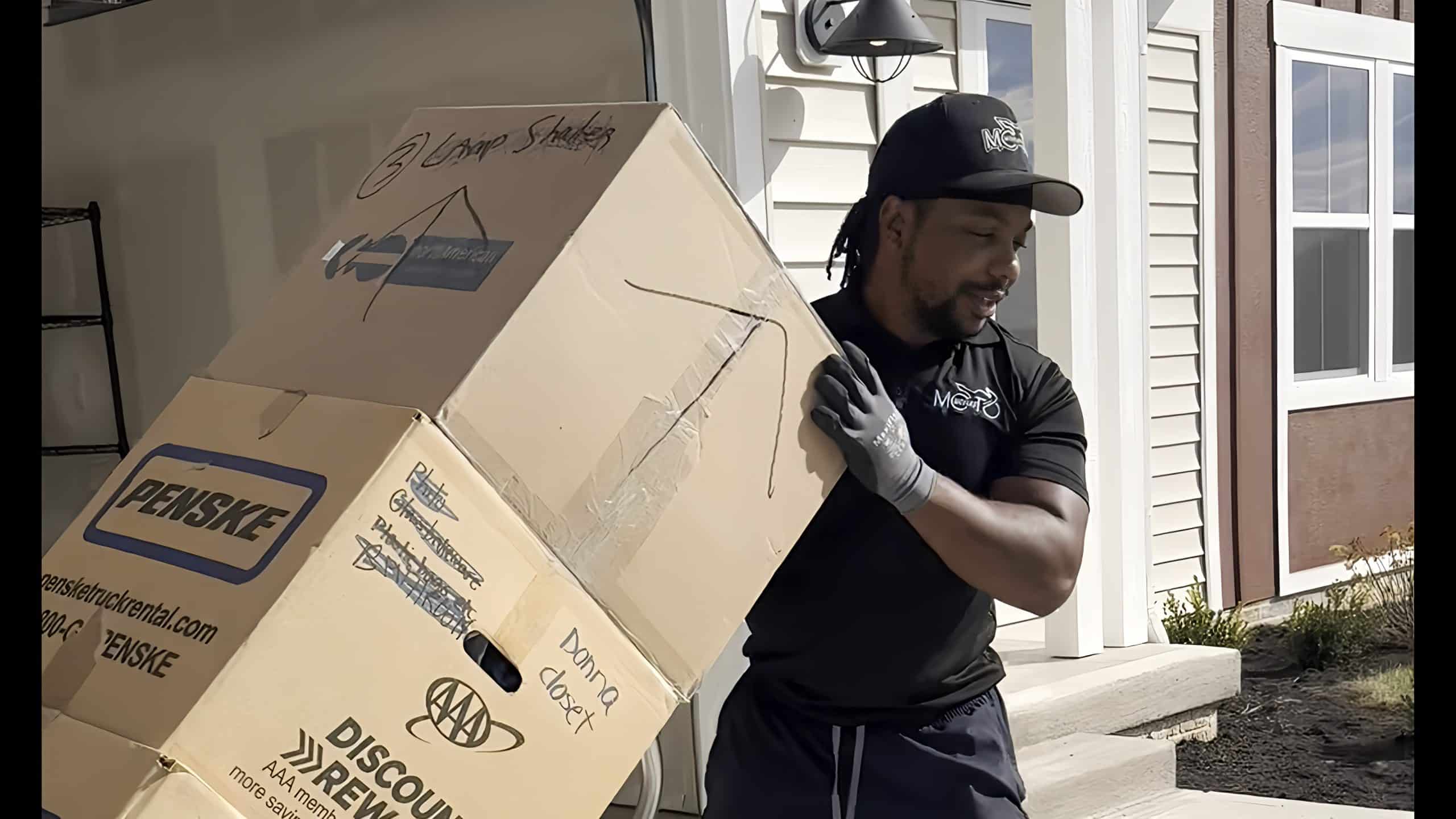 A mover using a dolly to move boxes