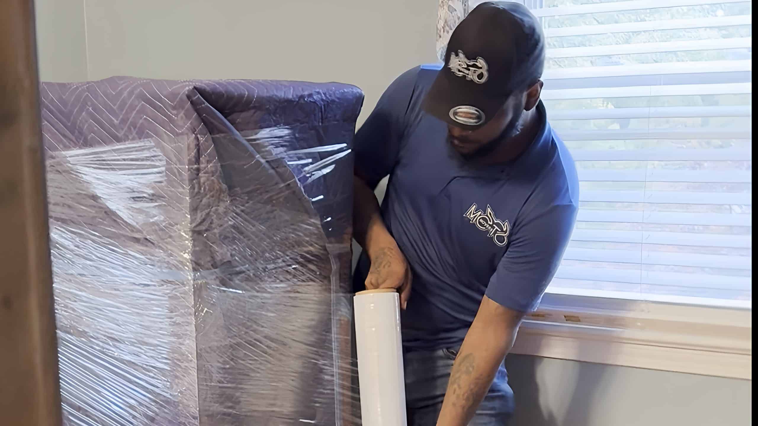 a mover preparing an item for moving