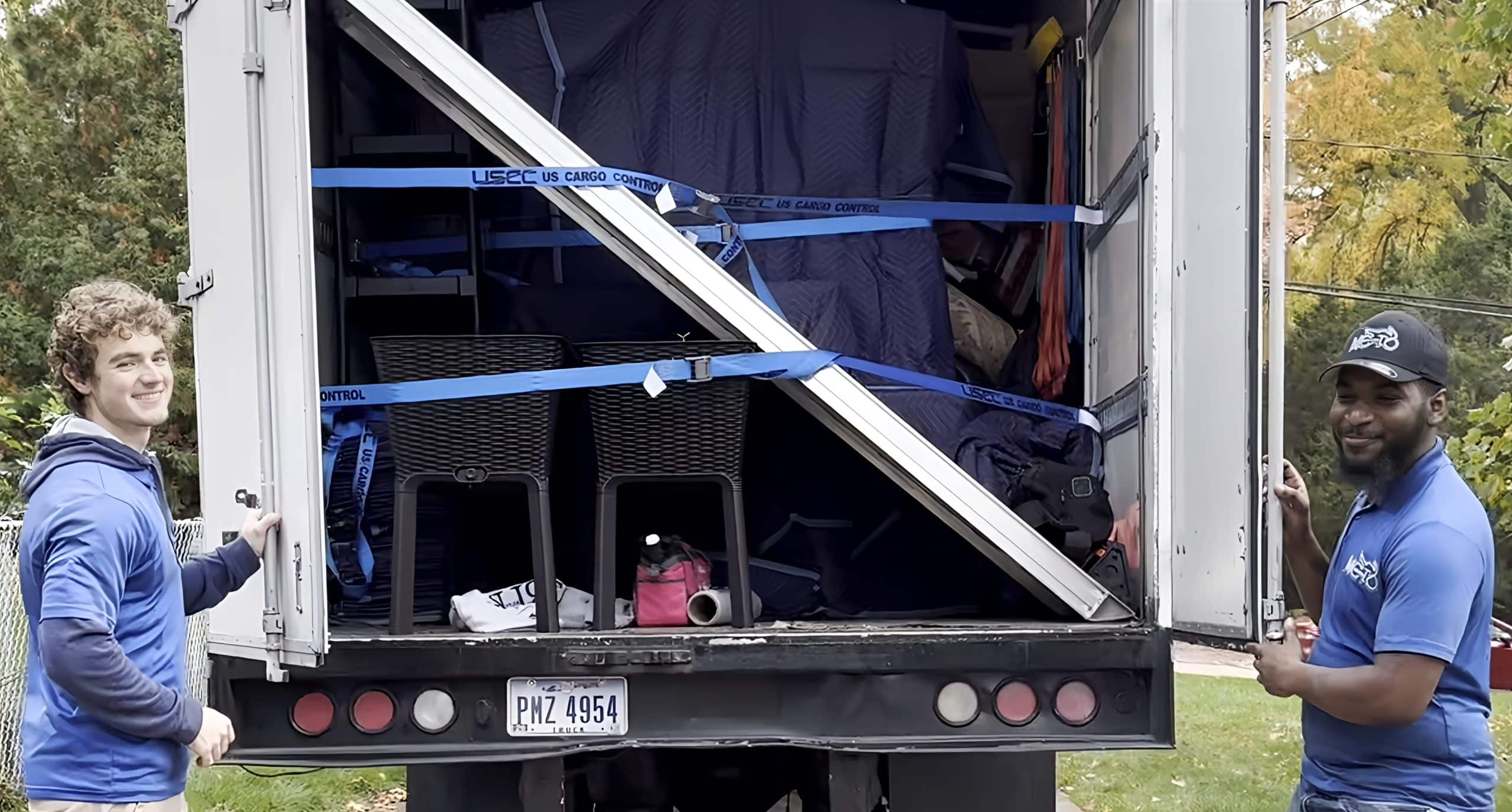 two movers holding open truck doors.